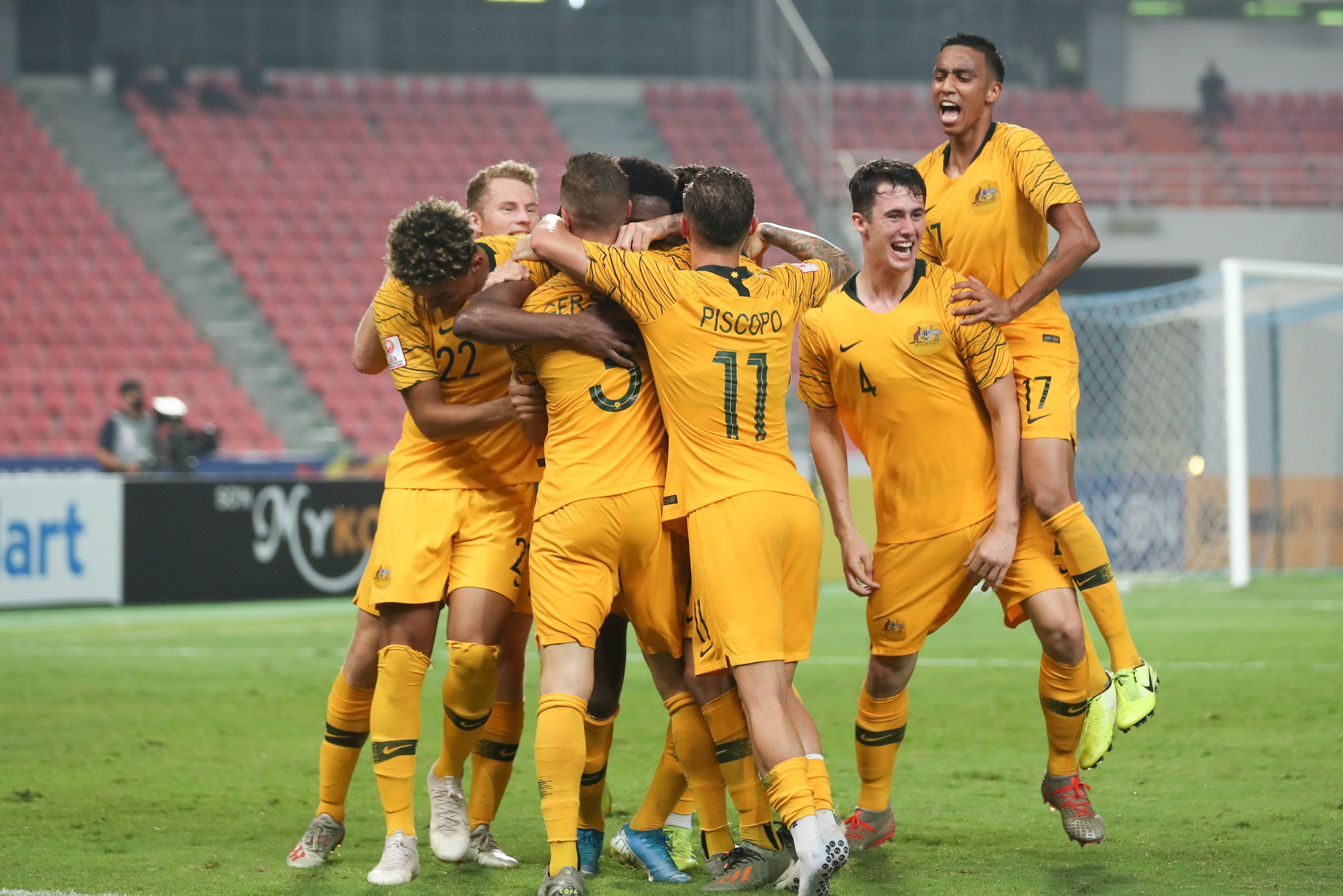 Australian players celebrate Toure's winning goal