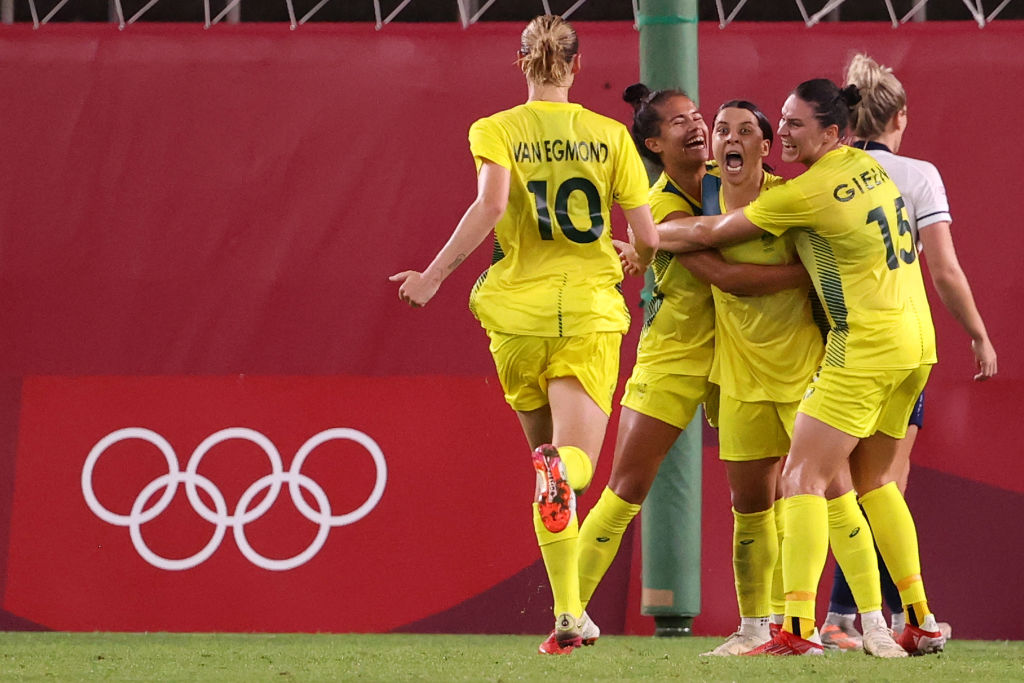 Sam Kerr #2 of Team Australia celebrates with team mates after scoring their side's fourth goal during the Women's Quarter Final match between Great Britain and Australia on day seven of the Tokyo 2020 Olympic Games at Kashima Stadium on July 30, 2021 in Kashima, Ibaraki, Japan. (Photo by Atsushi Tomura/Getty Images)