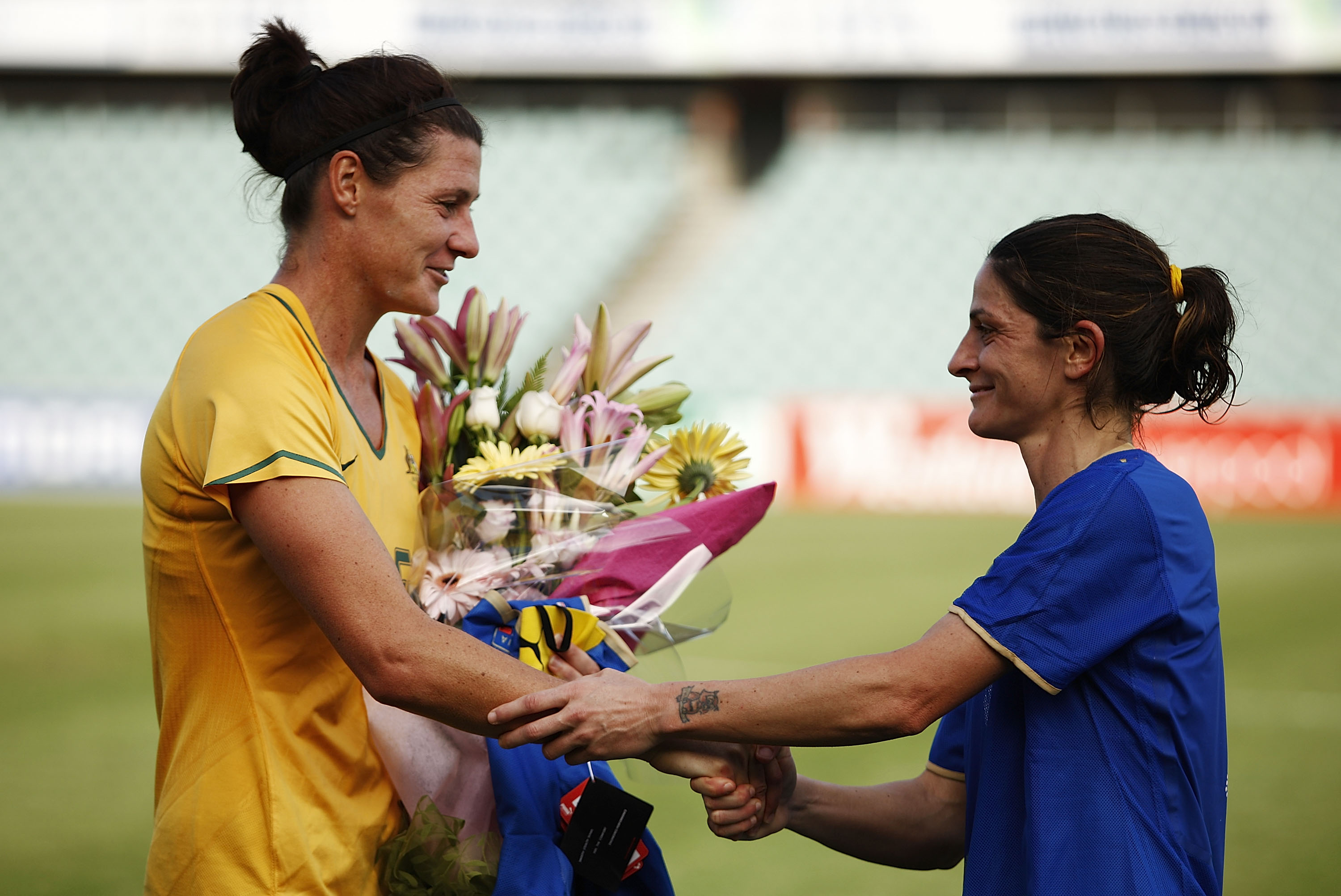 Cheryl Salisbury of Australia is presented with an Italian jersey from Patrizia Panico of Italy during the women's international friendly match between the Australian Matildas and Italy held at Parramatta Stadium January 31, 2009 in Sydney, Australia. (Photo by Brendon Thorne/Getty Images)