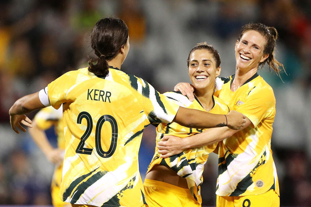 Katrina Gorry of the Matildas celebrates with her team mates Sam Kerr and Elise Kellond-Knight of the Matildas after scoring a goal during the Women's Olympic Football Tournament Qualifier match between the Australian Matildas and Chinese Taiepi at Campbelltown Sports Stadium on February 07, 2020 in Sydney, Australia. (Photo by Mark Kolbe/Getty Images)