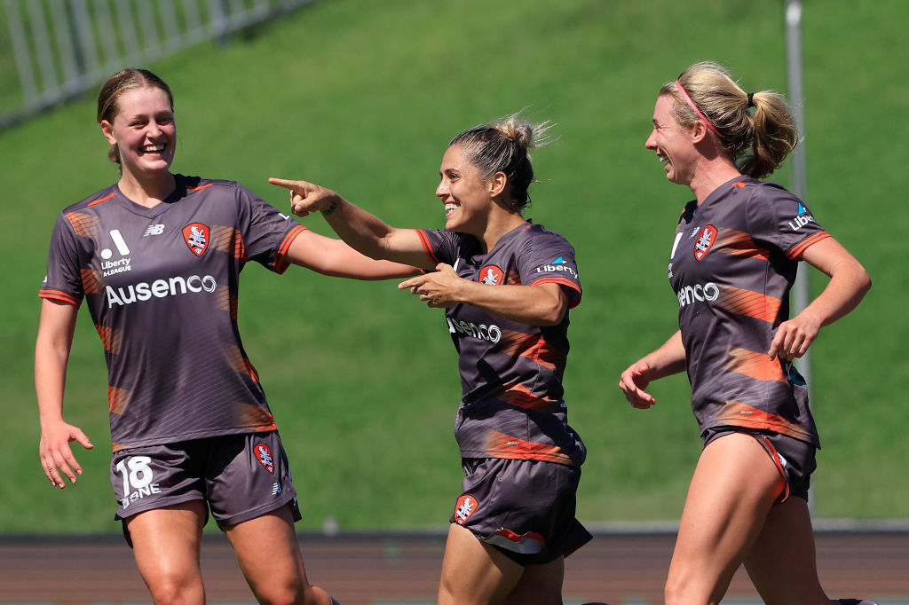 Katrina Gorry celebrates scoring with her Brisbane Roar team mates