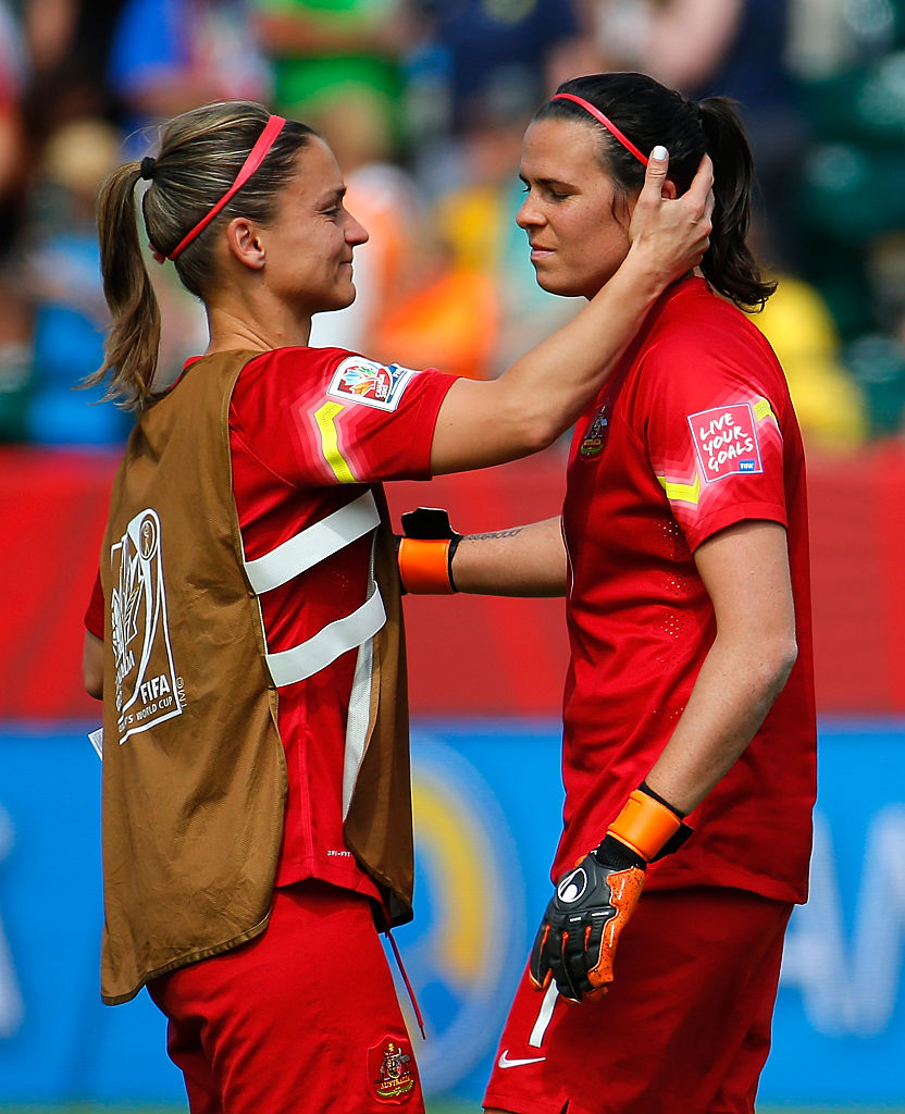 Melissa Barbieri #18 of Australia consoles goalkeeper Lydia Williams #1 after their 1-0 loss to Japan in the FIFA Women's World Cup Canada 2015 Quarter Final match between Australia and Japan at Commonwealth Stadium on June 27, 2015 in Edmonton, Canada. (Photo by Kevin C. Cox/Getty Images)