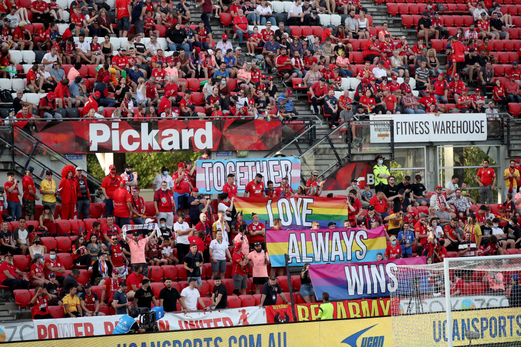 Pride support signs are seen in the crowd during the A-League men's match between Adelaide United and Central Coast Mariners at Coopers Stadium, on February 26, 2022, in Adelaide, Australia. (Photo by Kelly Barnes/Getty Images)