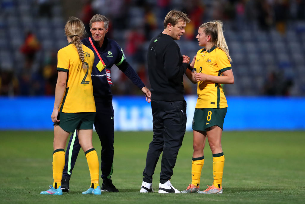 Tony Gustavsson consoles Charlotte Grant of Australia after their sides defeat during the Women's International Friendly match between Spain and Australia at Estadio Nuevo Colombino on June 25, 2022 in Huelva, Spain. (Photo by Fran Santiago/Getty Images)