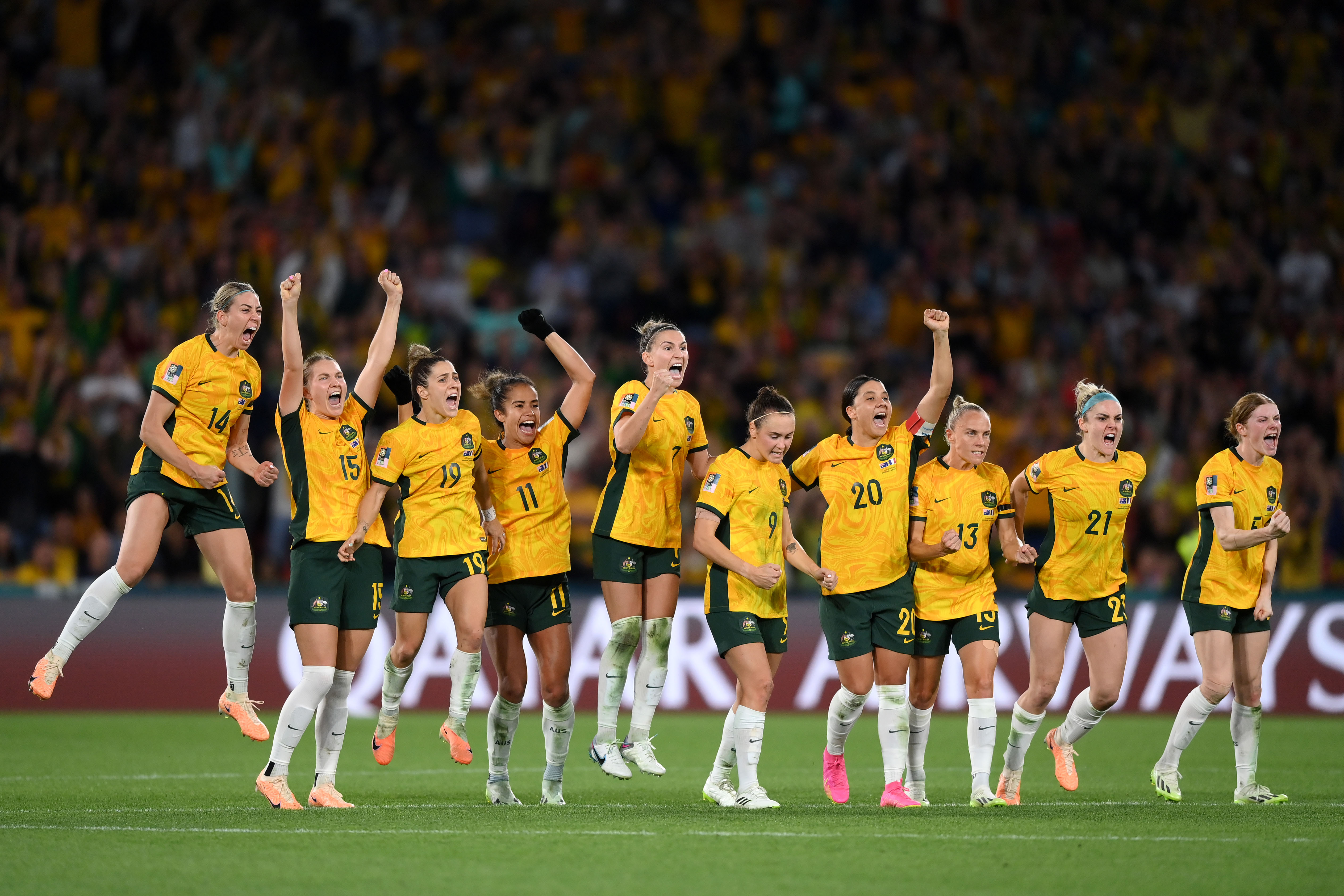 Players of Australia celebrate as Mackenzie Arnold of Australia saves the first penalty of France from Selma Bacha of France in the penalty shoot out during the FIFA Women's World Cup Australia & New Zealand 2023 Quarter Final match between Australia and France at Brisbane Stadium on August 12, 2023 in Brisbane / Meaanjin, Australia. (Photo by Justin Setterfield/Getty Images)