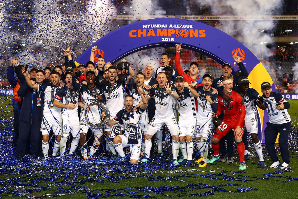 Melbourne Victory celebrate with the trophy