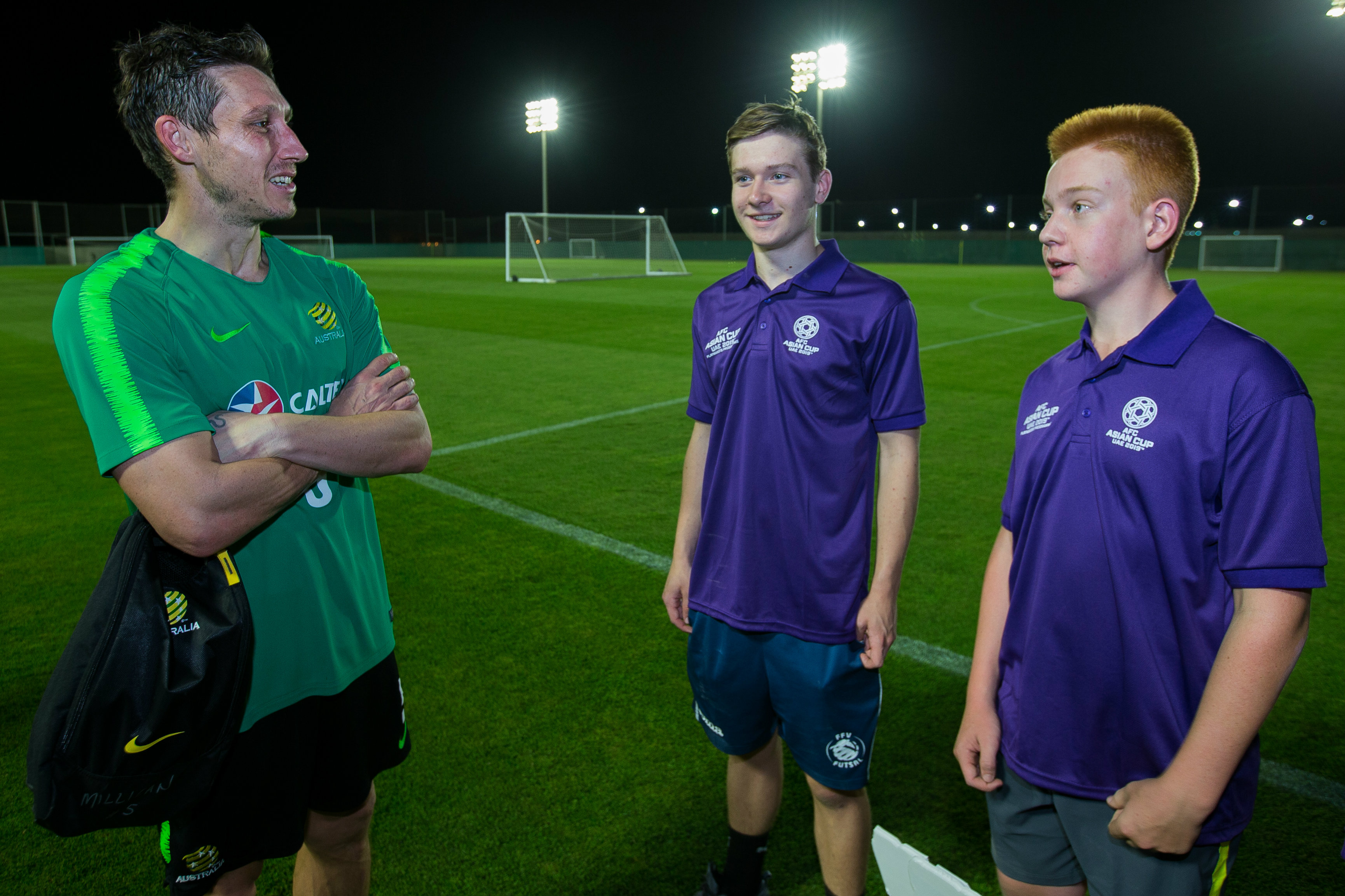 Mark Milligan chats with a couple of youngsters.