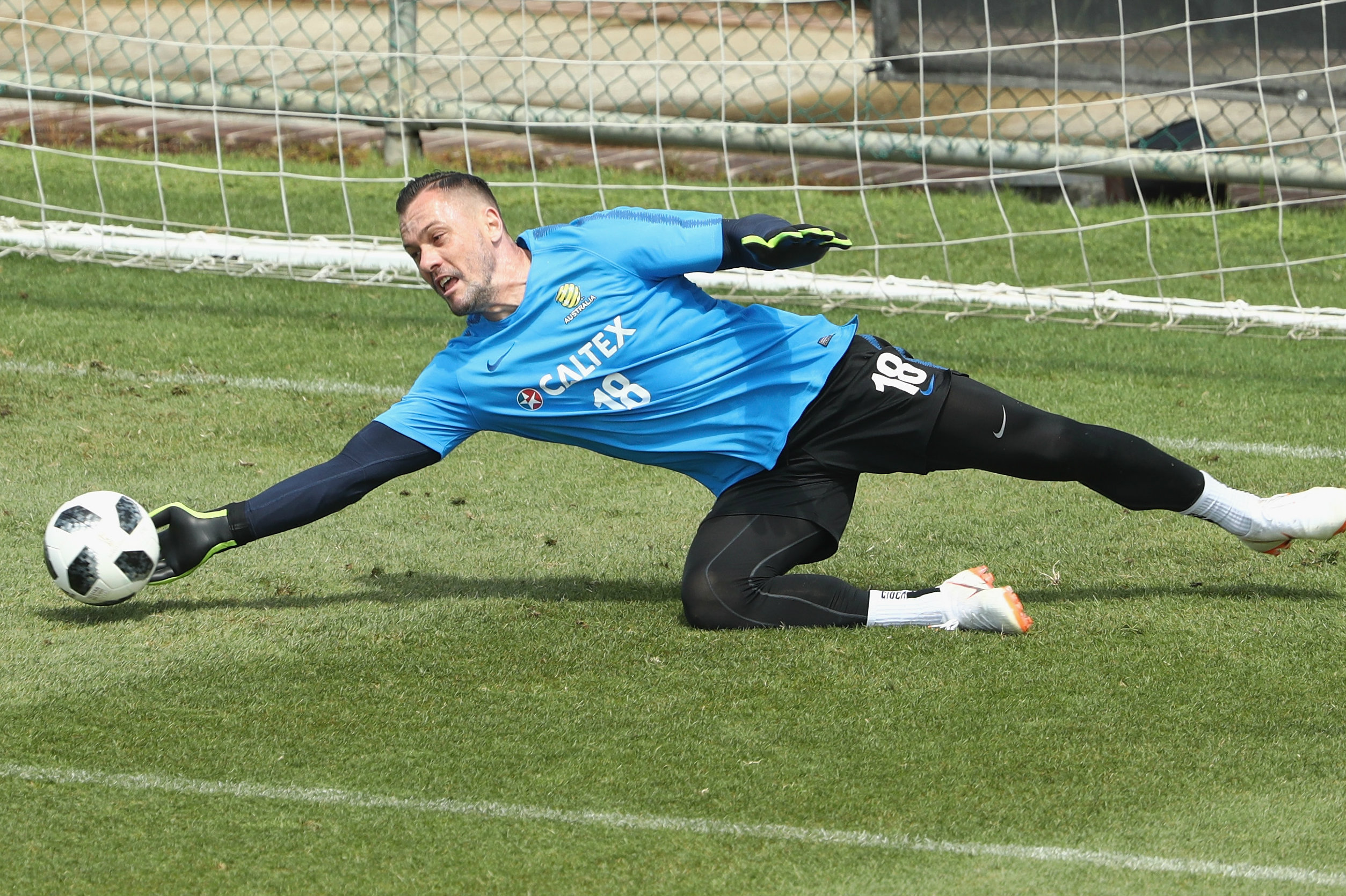 Danny Vukovic gets down low to make a save.