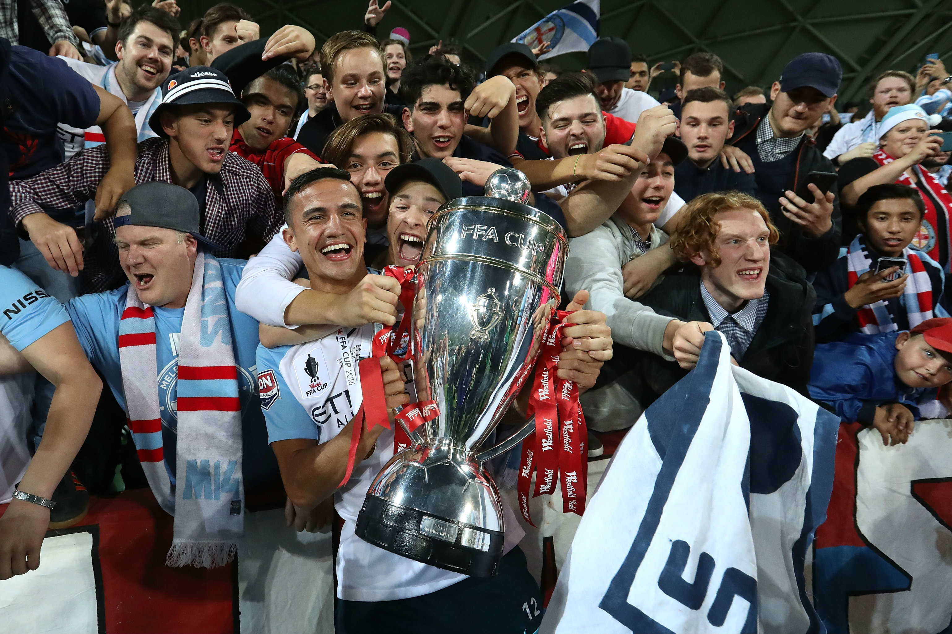 Tim Cahill gets his hands on the Westfield FFA Cup trophy.