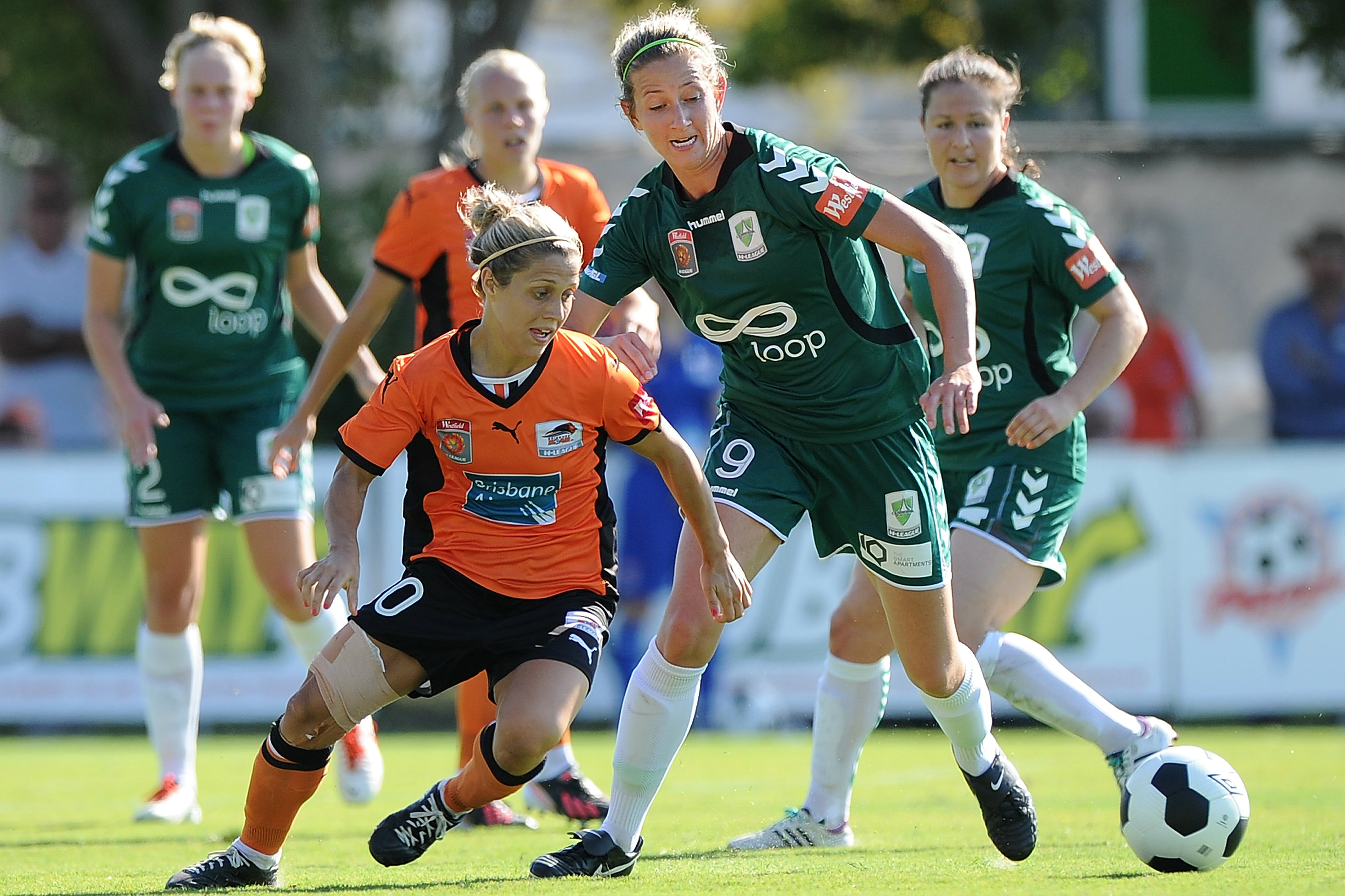 Grace Gill in a battle for possession with Brisbane Roar's Katrina Gorry 