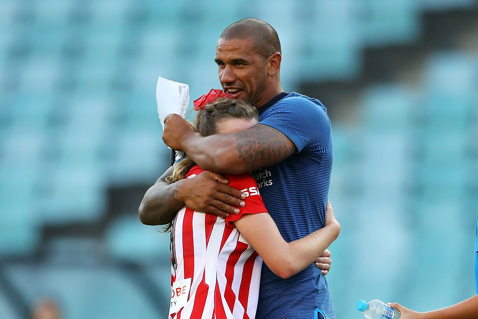 City boss Patrick Kisnorbo embraces one of his players after their Grand Final win.