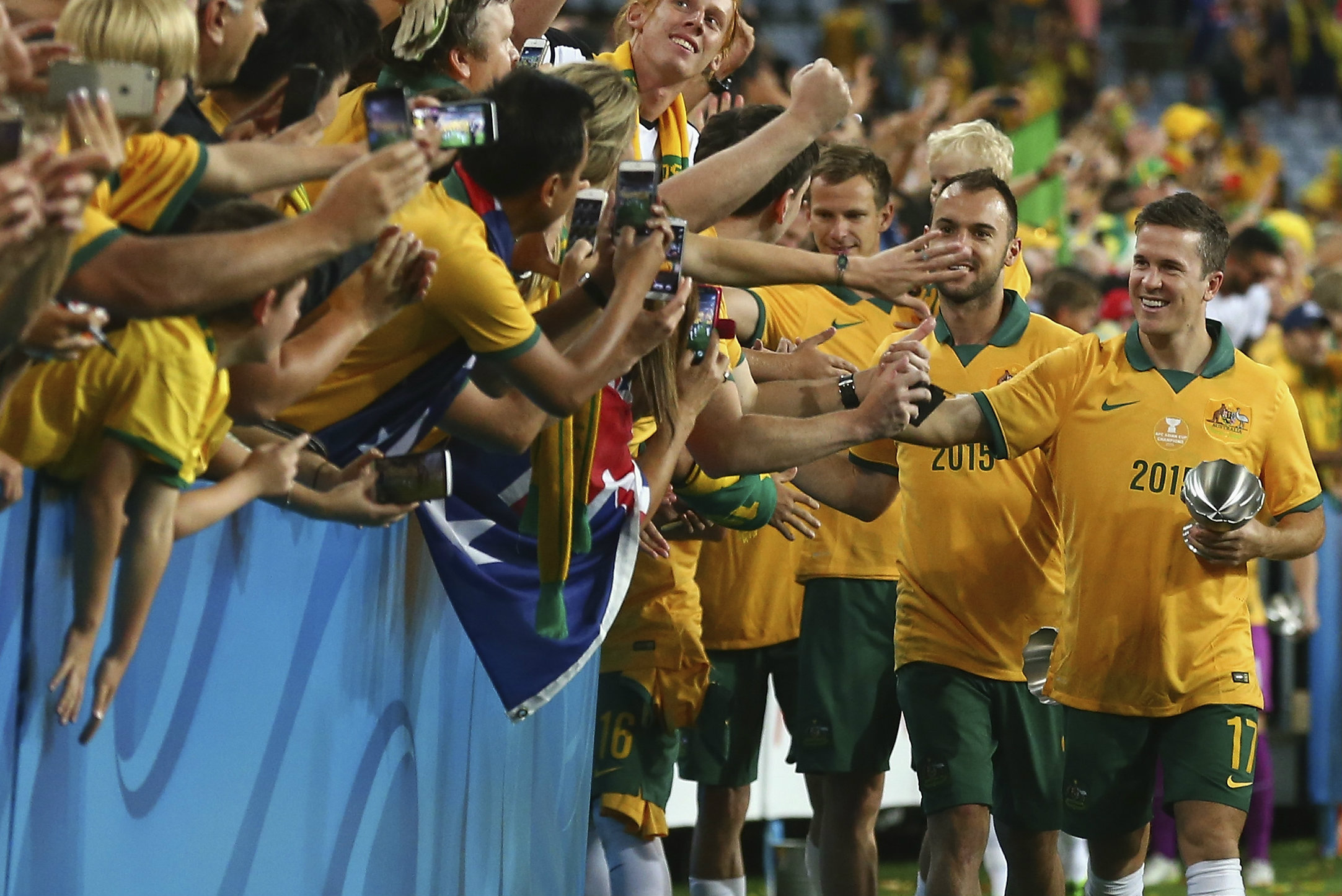 Matt McKay thanks the fans after the Caltex Socceroos 2015 AFC Asian Cup triumph
