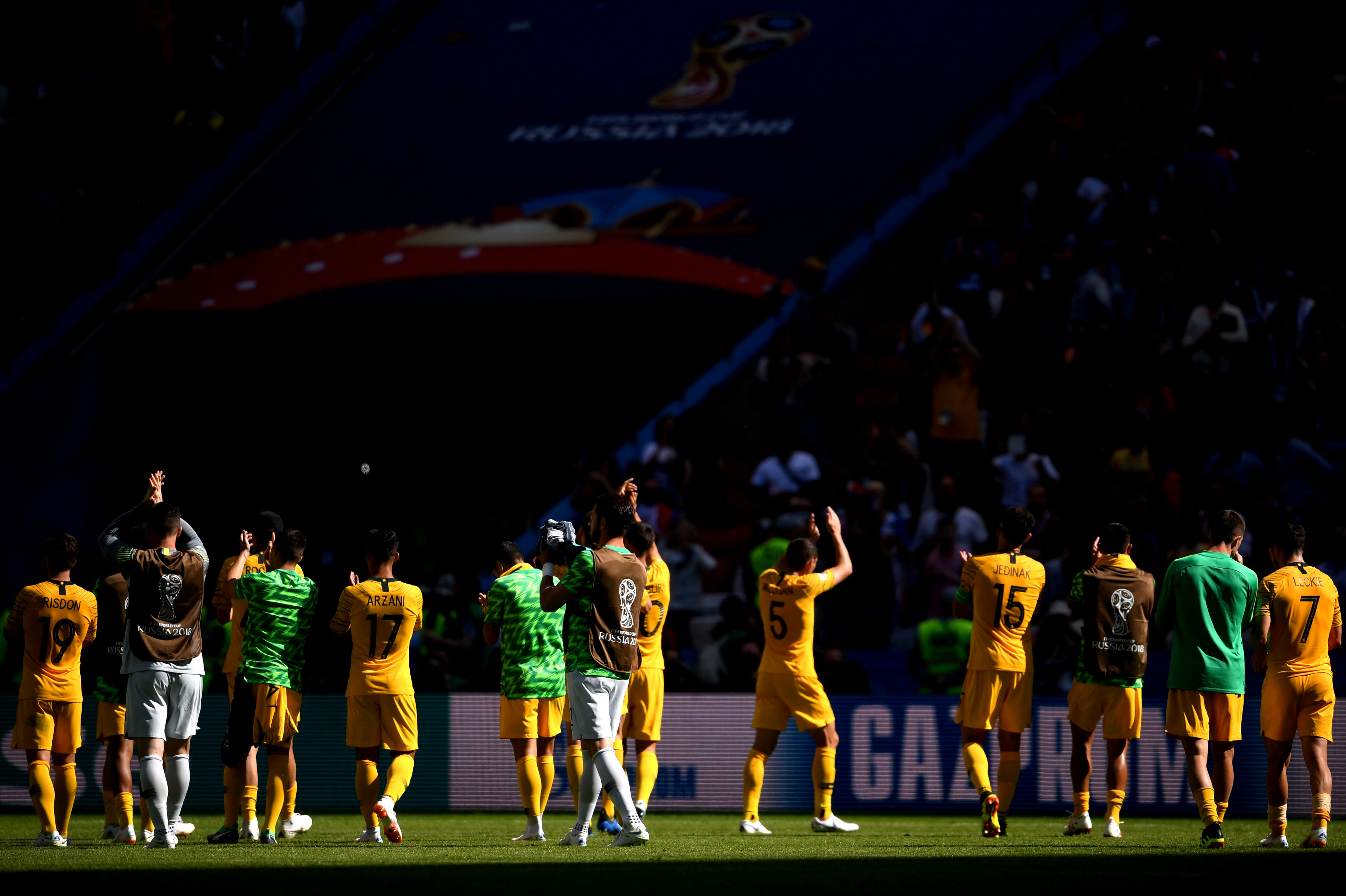 Socceroos players thank the fans for their support inside the Kazan Arena.
