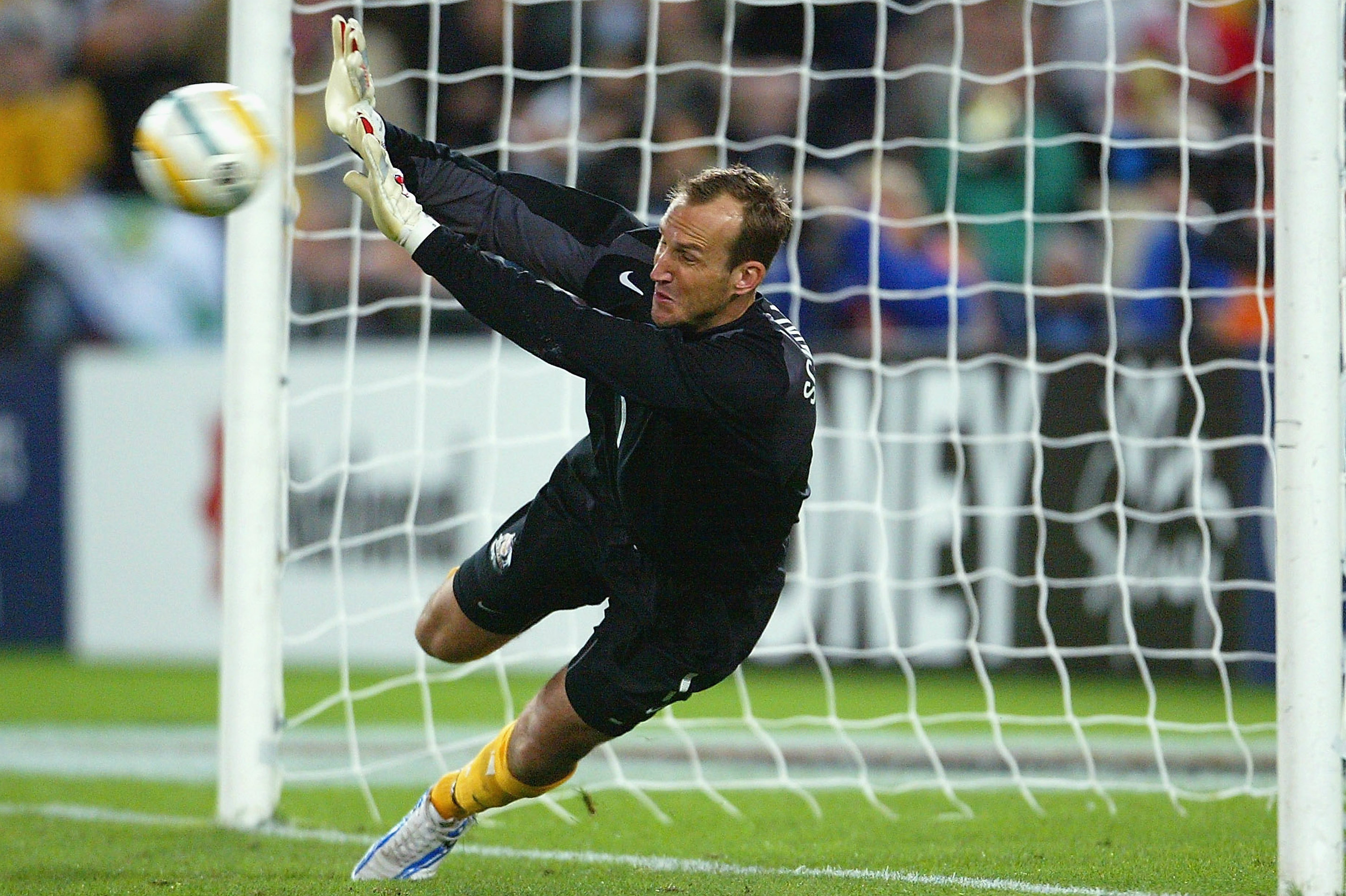 Mark Schwarzer makes a save in the shootout against Uruguay in 2005.