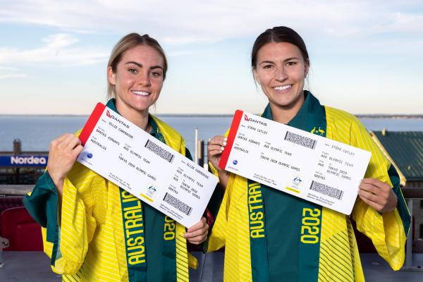 Ellie Carpenter and Steph Catley with their Tokyo 2020 Olympic Qantas boarding passes