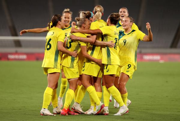 ameka Yallop #13 of Team Australia celebrates with team mates after scoring their side's first goal during the Women's First Round Group G match between Australia and New Zealand during the Tokyo 2020 Olympic Games at Tokyo Stadium on July 21, 2021 in Chofu, Tokyo, Japan. (Photo by Dan Mullan/Getty Images)