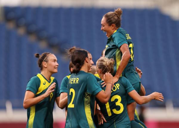 Sam Kerr #2 of Team Australia celebrates with team mates after scoring their side's second goal during the Women's First Round Group G match between Sweden and Australia on day one of the Tokyo 2020 Olympic Games at Saitama Stadium on July 24, 2021 in Saitama, Japan. (Photo by Francois Nel/Getty Images)
