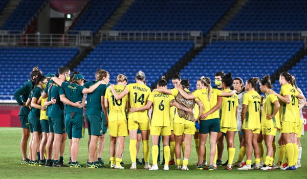 Australia's players gather in a huddle after their loss during the Tokyo 2020 Olympic Games women's semi-final football match between Australia and Sweden at Yokohama International Stadium in Yokohama on August 2, 2021. (Photo by Anne-Christine POUJOULAT / AFP) (Photo by ANNE-CHRISTINE POUJOULAT/AFP via Getty Images)