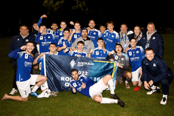 Modbury holding banner after Round of 32 win over Armadale