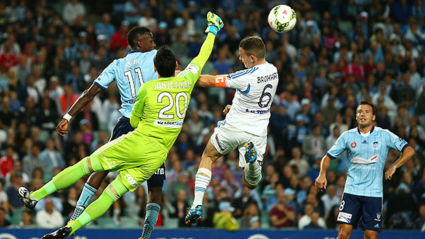 Vedran Janjetovic flies high to clear the ball in the beyondblue Cup.